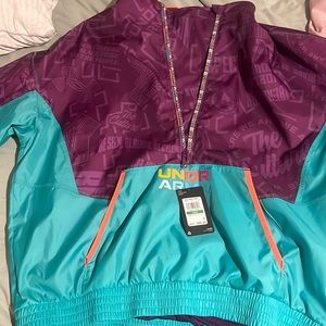 New tags still on!!! Unisex size LG Under armor pull over jacket with zipper.